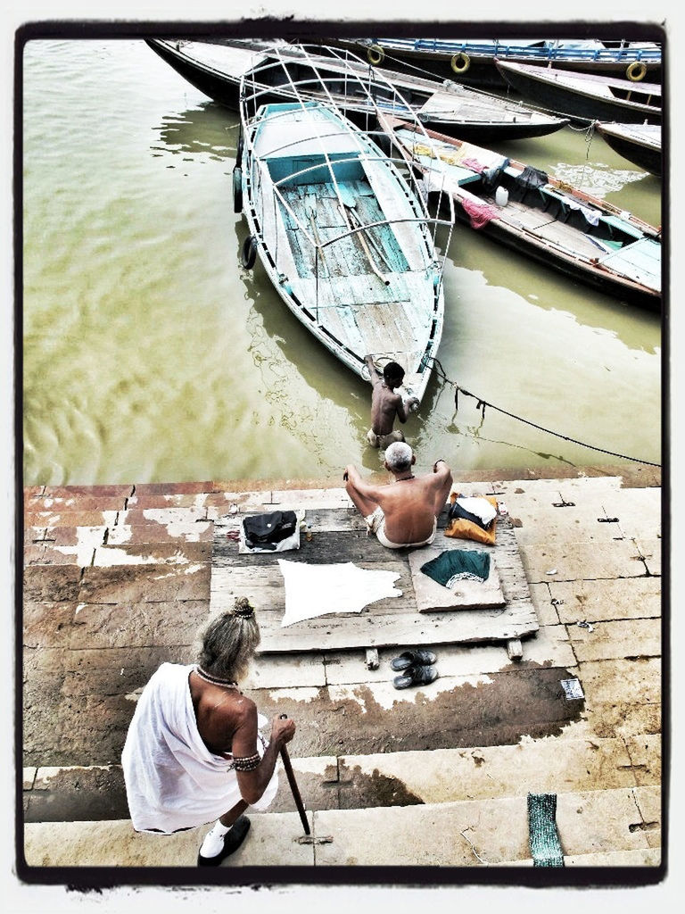 lifestyles, transfer print, leisure activity, auto post production filter, full length, water, holding, casual clothing, childhood, person, nautical vessel, boys, men, sitting, transportation, mode of transport, high angle view, side view