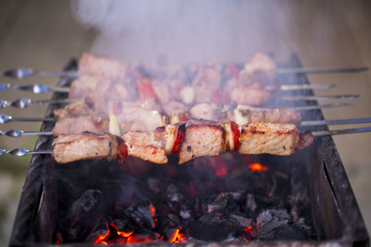 Close-up of meat grilling on barbecue