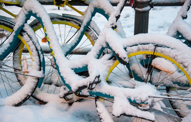 High angle view of snow covered bicycle on field