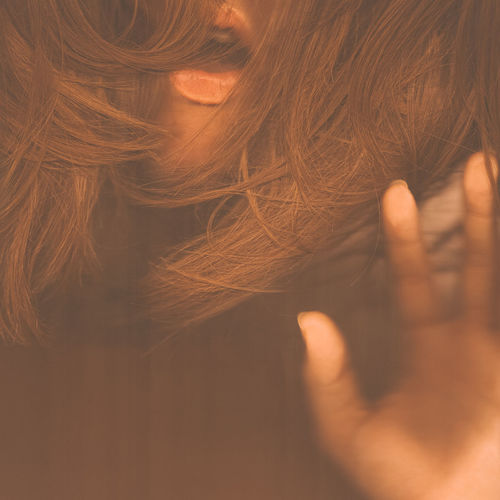 Cropped image of sensuous woman with brown hair