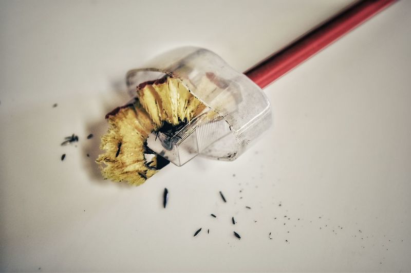 Close-up of pencil in sharpener on table