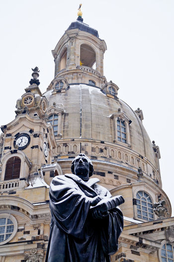Statue of martin luther king against dresden frauenkirche