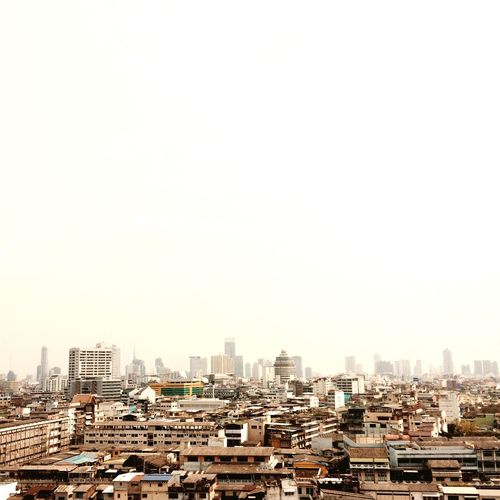 Buildings against clear sky