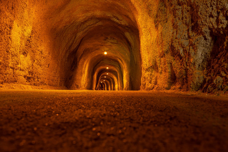 Pedestrian mountain tunnel with illumination . coastal illuminated tunnel in rafailovici montenegro