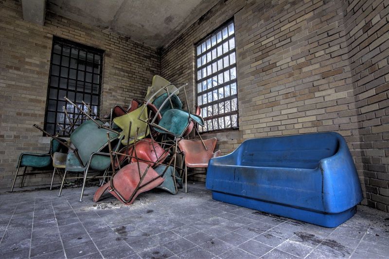 Interior of abandoned building with scrap furniture