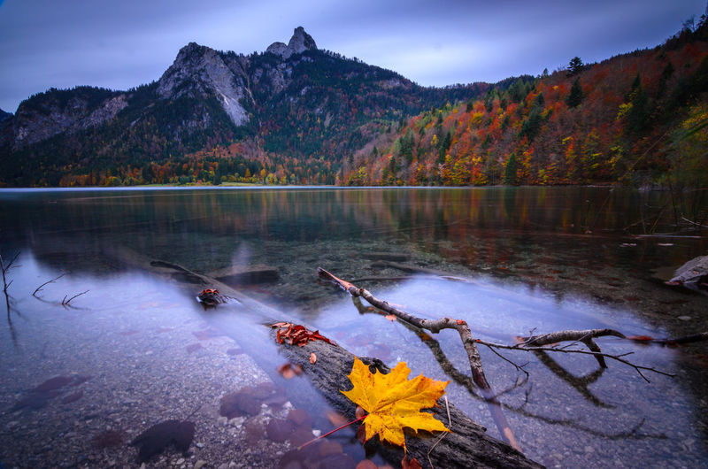 Scenic view of lake against mountain during autumn