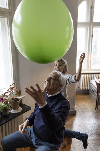 Boy playing with balloons