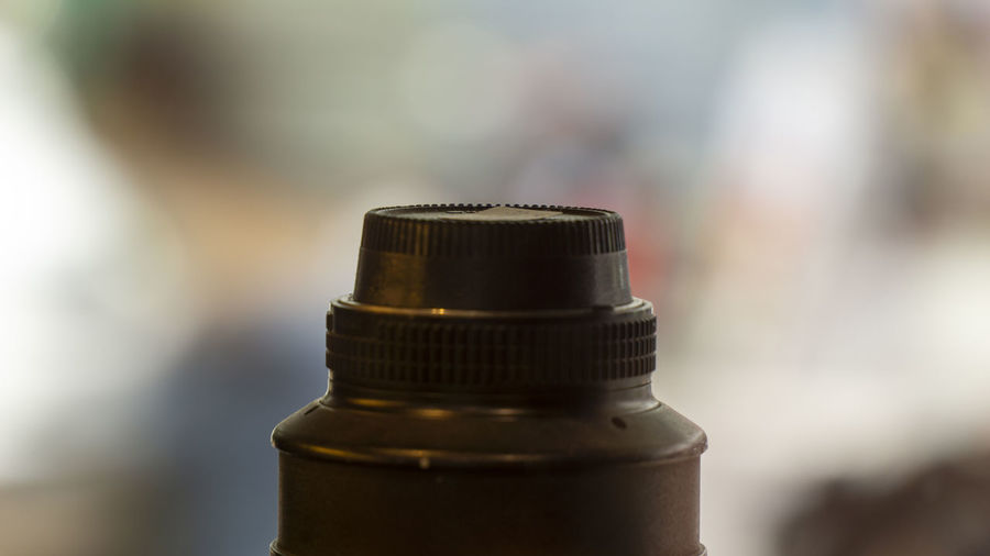Close up of a camera lens top and its cover
