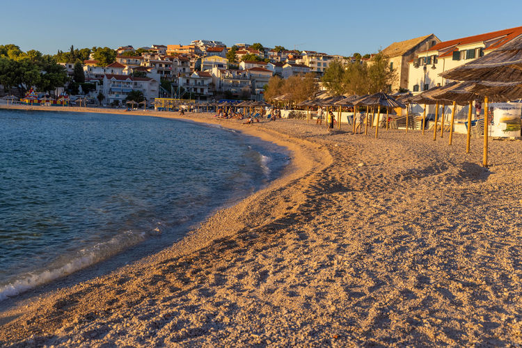Sunset on the beach in primosten town, the adriatic sea, croatia