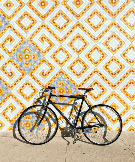 High angle view of bicycle parked on wall
