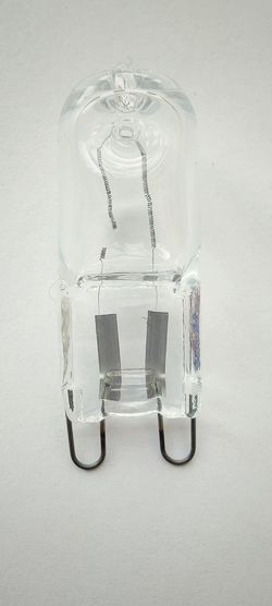 High angle view of glasses on table against white background