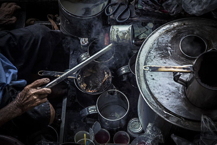 High angle view of person making hot drink