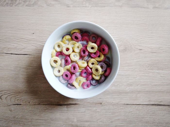High angle view of breakfast cereal bowl on wooden table