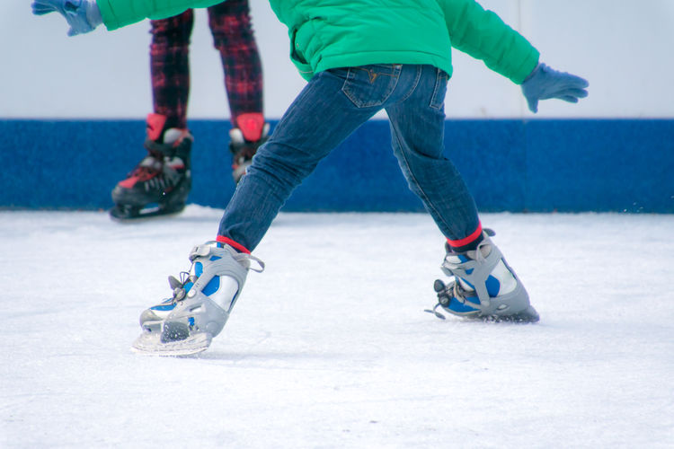 Low section of people skating on ice