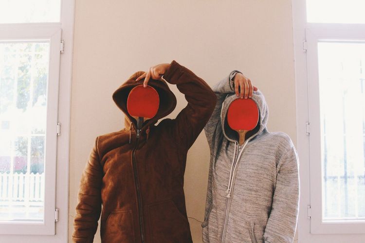 Two funny people with obscured faces