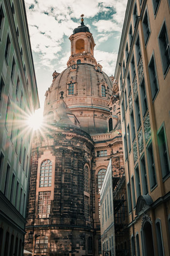 Low angle view of buildings against sky in city
