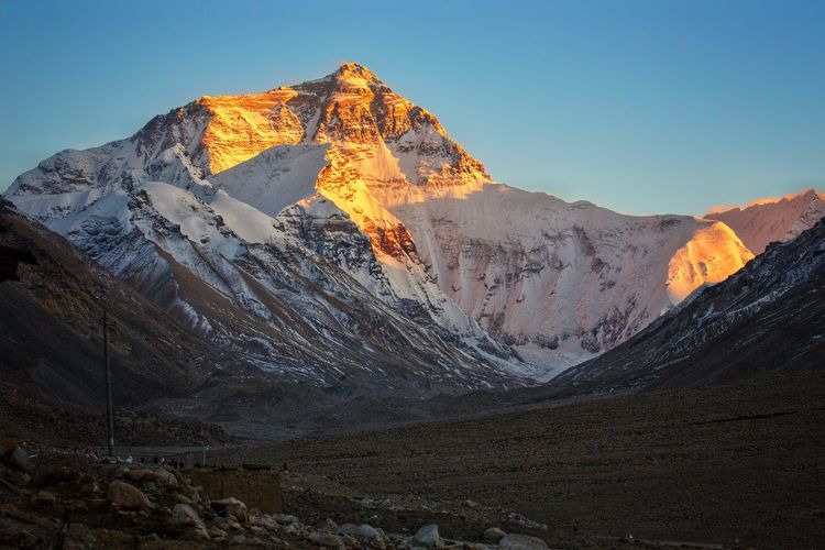 Last rays of the sun hitting the peak of mt. everest in the himalayas at sunset, highest mountain