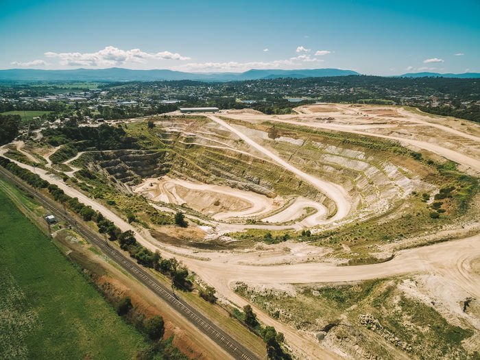 Aerial view of big abandoned limestone mine and mountains in australia