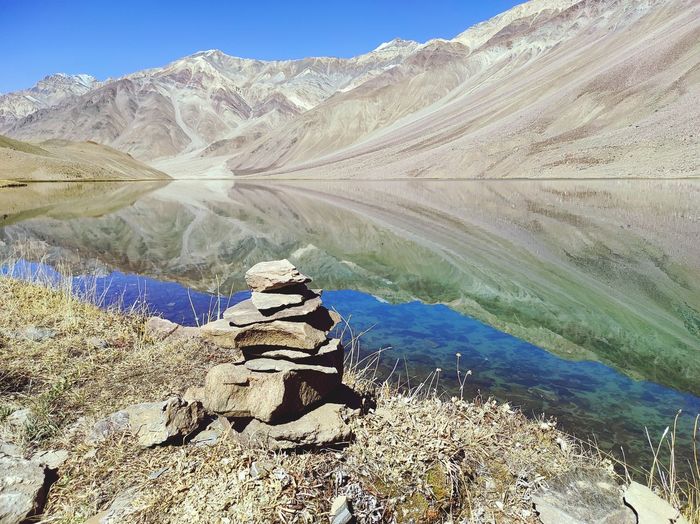 Stones stacked on the bank of holy chandrataal lake in himalayas to make a wish.