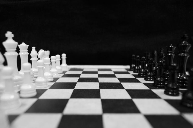 Close-up of chess board against black background