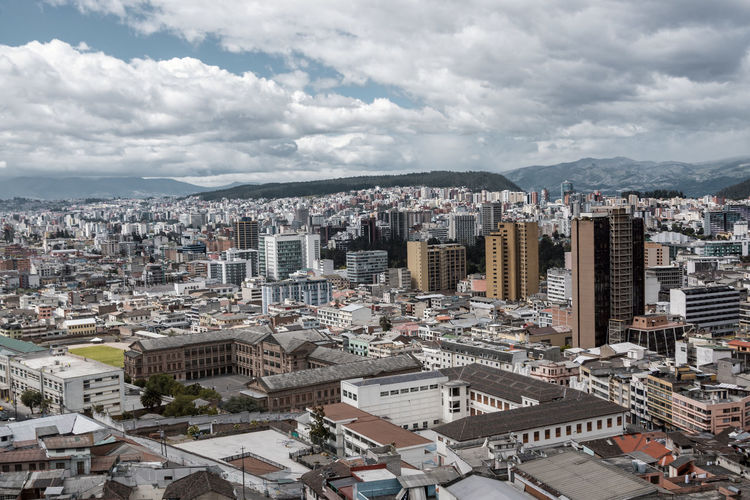 High angle view of buildings in city against sky