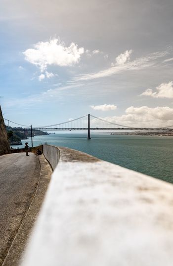 Surface level of bridge over sea against sky portugal lisboa 