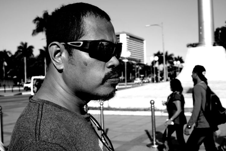 Man in shade with moustache gangsta