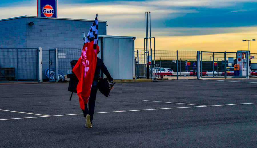 View of red flag on road against sky