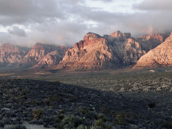 Scenic view of landscape and mountains against sky
