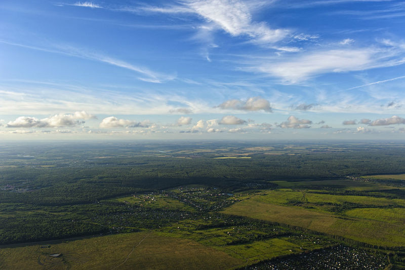 Aerial view of agricultural landscape against sky
