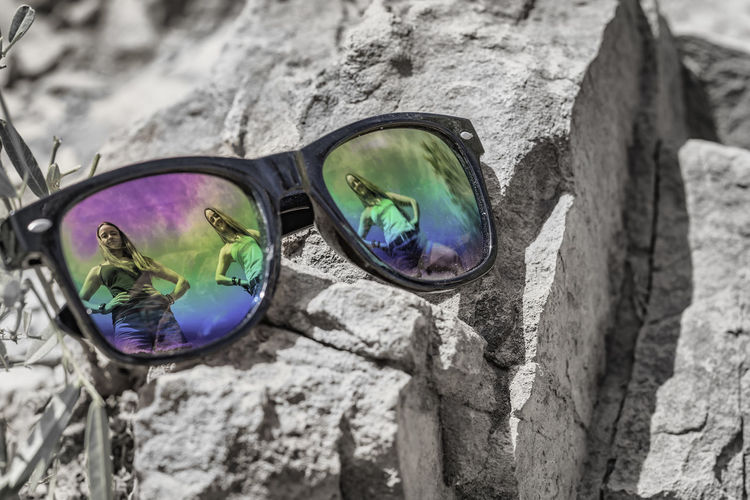 High angle view of sunglasses on rock