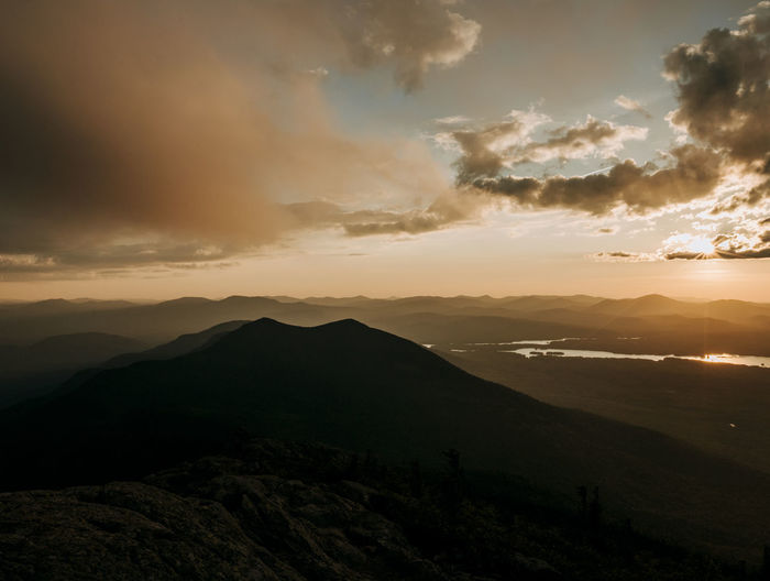 Golden light at sunset from summit of bigelow mountain, maine