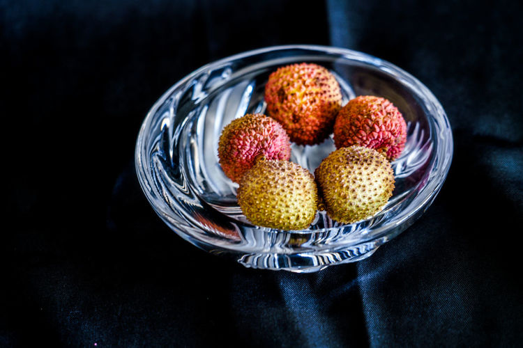 Close-up of lychee in bowl on table