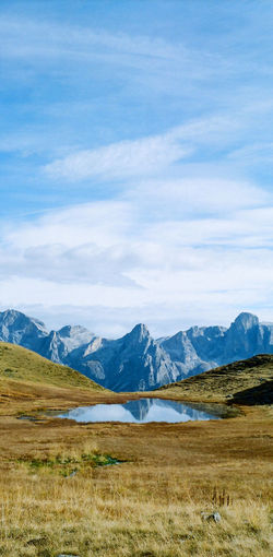Scenic view of landscape and mountains against sky