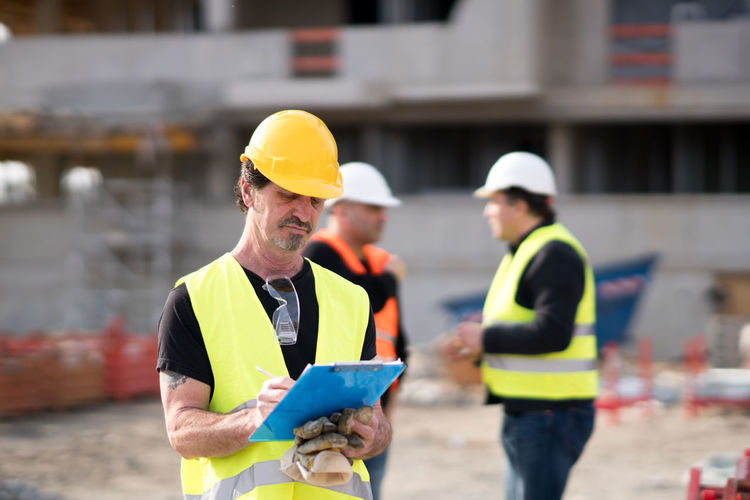 Manual workers working at construction site