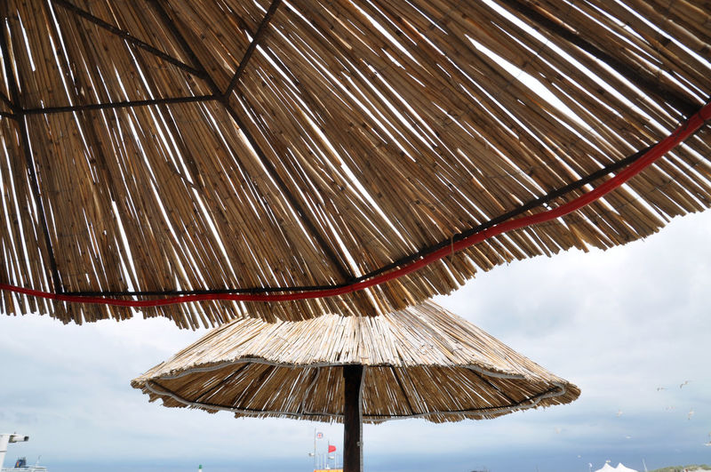 Low angle view of beach umbrella against sky