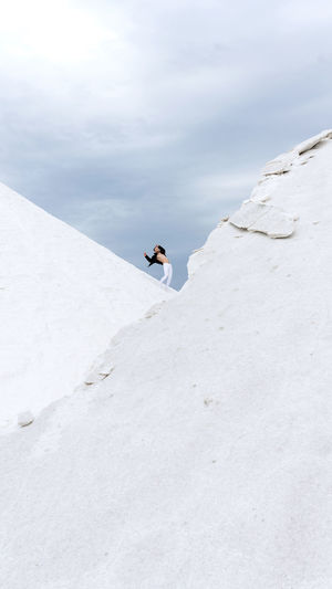 Man standing on snow against sky