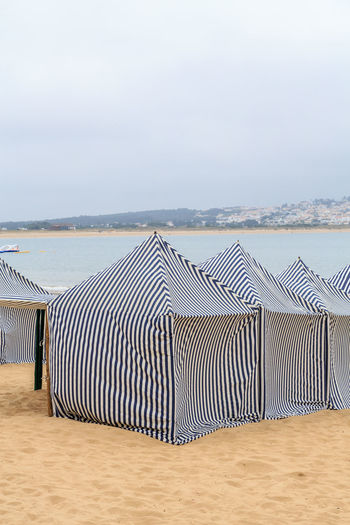  tents on the beach against the sky