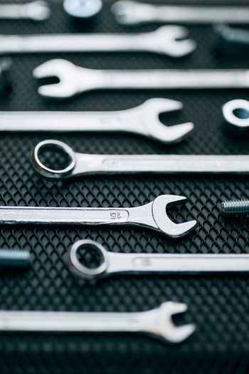 Set of chrome wrenches on steel surface. mechanic tools for maintenance. hardware tools to fix. tech