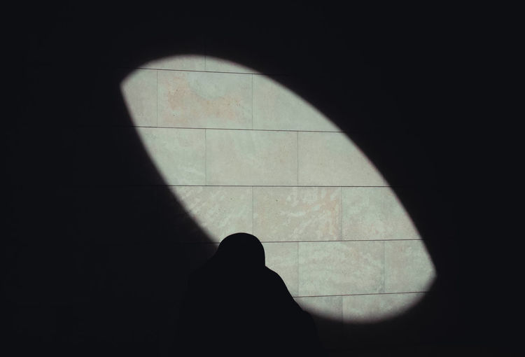 Shadow of man on window