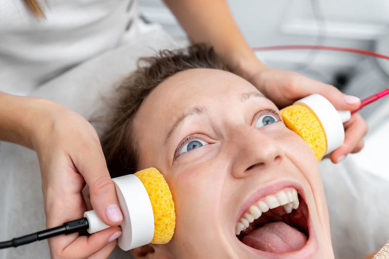 Close-up of woman getting beauty treatment