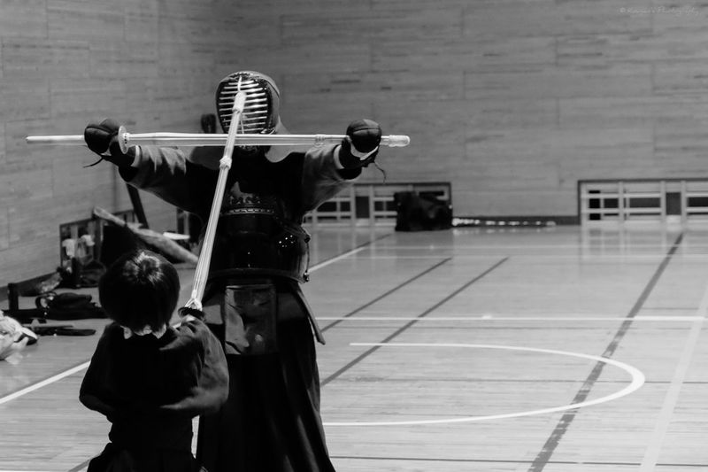 Two people practicing kendo