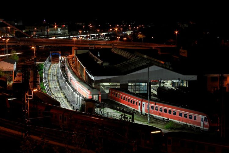 Illuminated train station at night