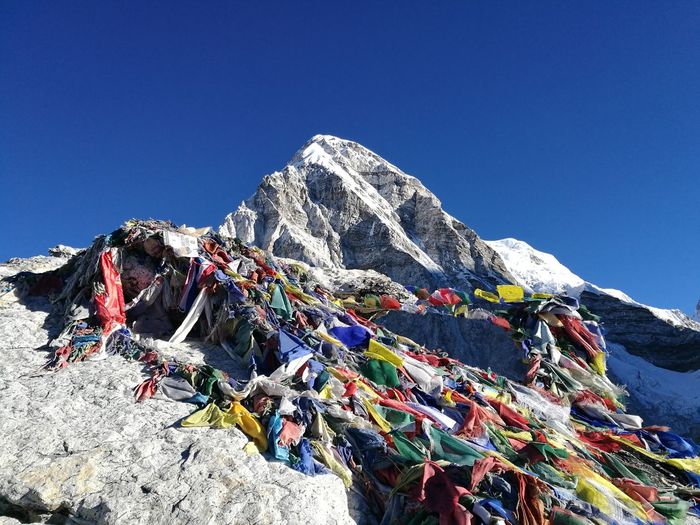 Scenic view of mountain against clear blue sky