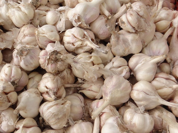 Full frame shot of garlic vegetables for sale in market