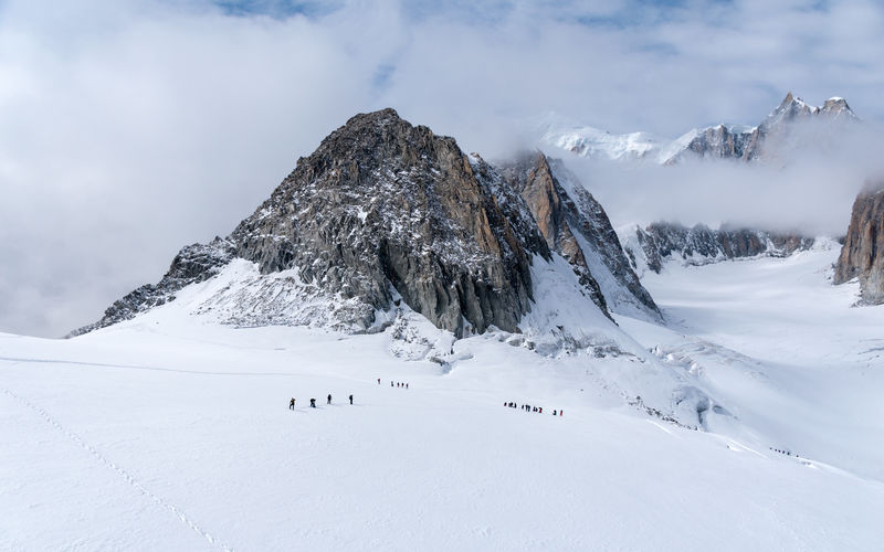The glacier du geant on the mont blanc massif, with a group of mountaineers