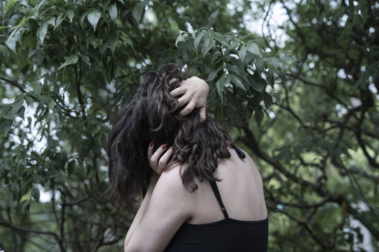 Woman in nature being upset