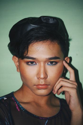 Close-up portrait of young man with make-up