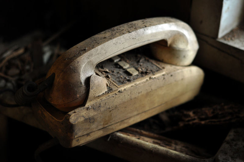 Close-up of abandoned telephone