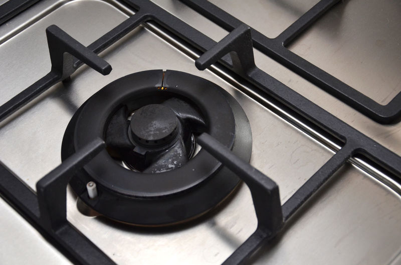 Close-up of gas stove burner in kitchen